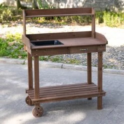 Outsunny 36'' Wooden Potting Bench Work Table With 2 Removable Wheels, Sink, Drawer & Large Storage Spaces, Brown 23 Outsunny 36'' Wooden Potting Bench Work Table With 2 Removable Wheels, Sink, Drawer & Large Storage Spaces, Brown -Outsunny Wdm17417e681f8e39